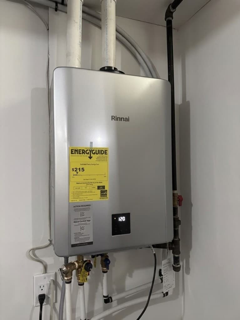 Rinnai tankless water heater installed in a finished mechanical closet